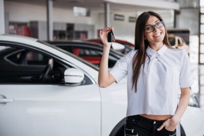girl holding car keys