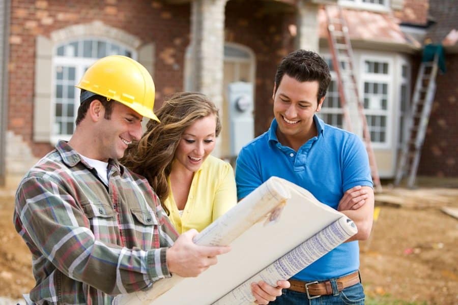 couple looking at construction plans