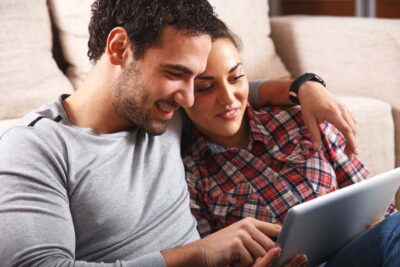 young couple on tablet