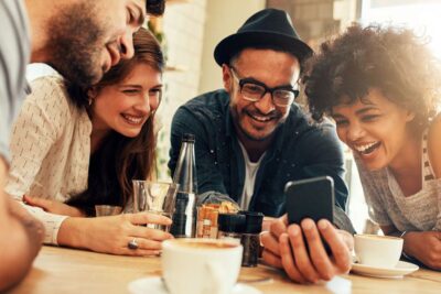 friends looking at smartphone